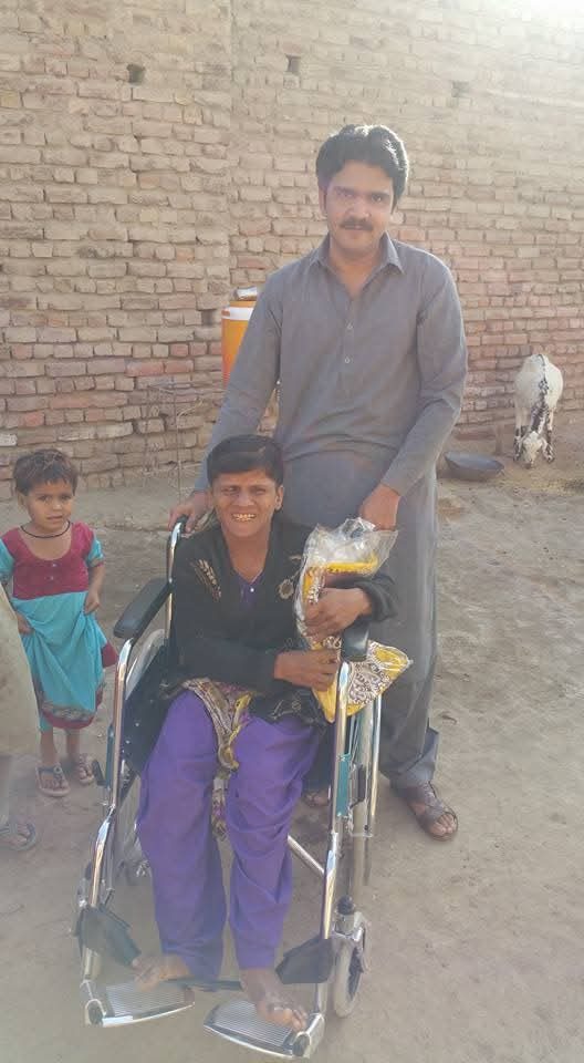 ZDO team supporting a community member with a disability in Dadu